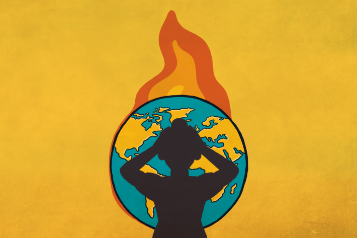 How the Climate Crisis Affects Reproductive Rights post image-a person standing in front of a burning earth